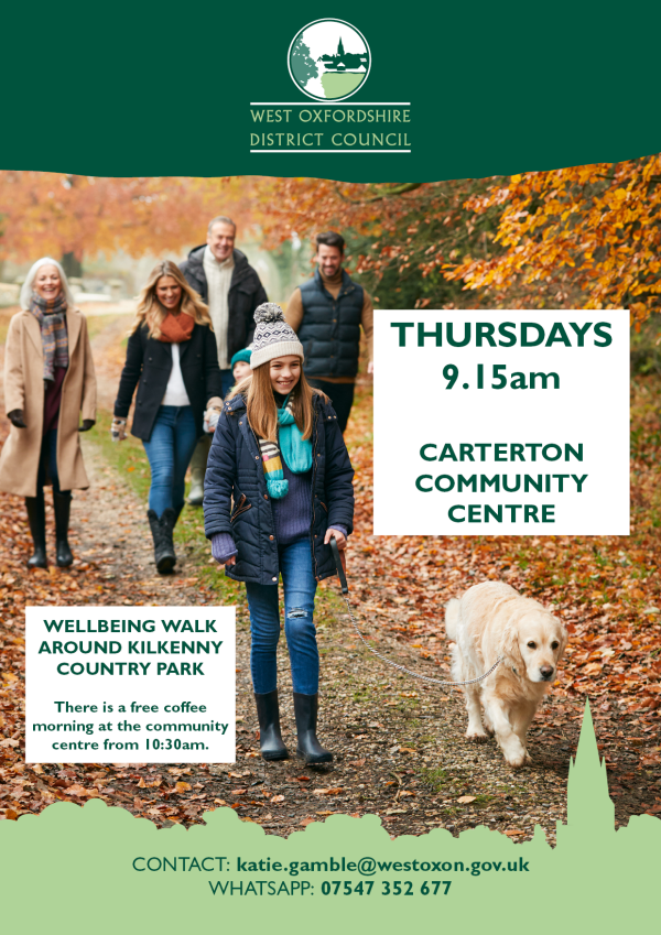 People of different generations waling in a park with a dog